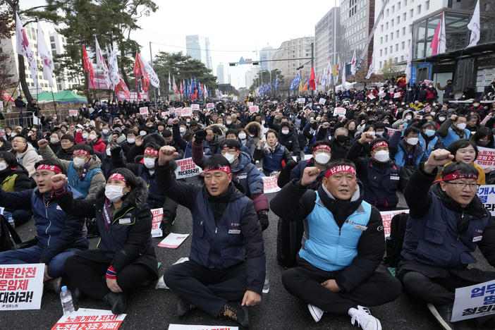 Members of the Korean Confederation of Trade Unions shout slogans during a rally against the government's labor policy near the National Assembly in Seoul on Saturday.