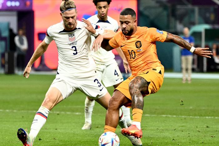 USA defender Walker Zimmerman (#3) fights for the ball with Netherlands' forward Memphis Depay during the 2022 World Cup round of 16 match at Khalifa International Stadium in Al Rayyan, Qatar, on Saturday.