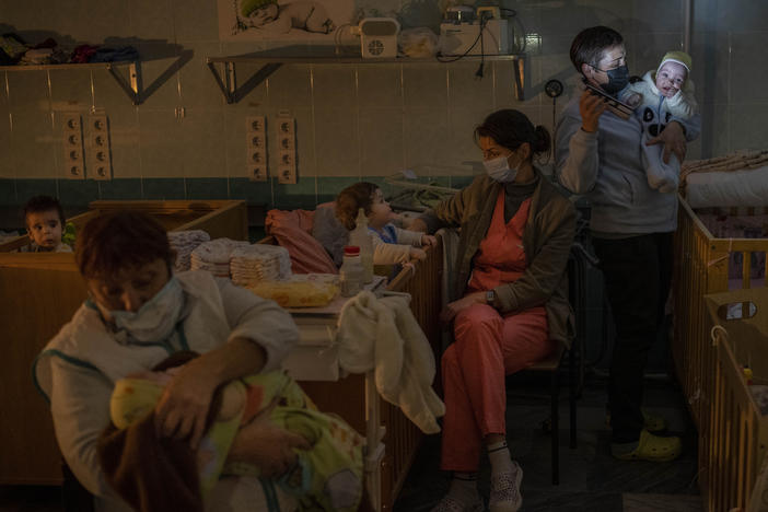 Hospital staff take care of orphaned children at the children's regional hospital maternity ward in Kherson, southern Ukraine, Tuesday, Nov. 22, 2022. Throughout the war in Ukraine, Russian authorities have been accused of deporting Ukrainian children to Russia or Russian-held territories to raise them as their own.