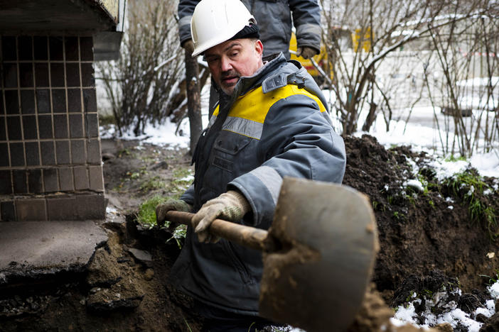 Technicians from DTEK, Ukraine's largest private energy company, work to replace a cable at a substation in the Teremky neighborhood of Kyiv on Wednesday.