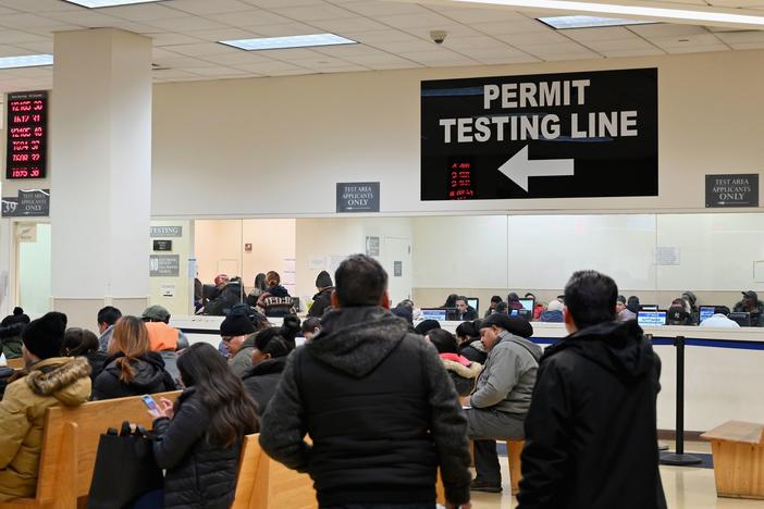 People wait at the New York State Department of Motor Vehicles office at Atlantic Center in the Brooklyn borough of New York on December 18, 2019.