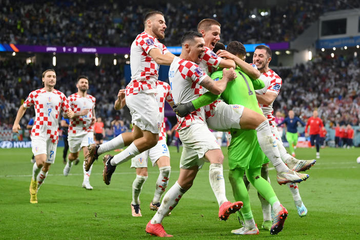 Croatia players celebrate after winning the tournament's first penalty shoot out during the 2022 World Cup round of 16 match between Japan and Croatia at Al Janoub Stadium on December 05, 2022 in Al Wakrah, Qatar.
