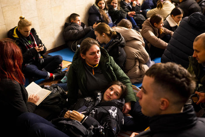 Svitlana (center) and Anastasiya (bottom) take shelter with their McDonald's coworkers in Lva Tolstoho Metro during an air alert in Kyiv on Monday. Russia renewed its missile attacks across Ukraine on Monday.