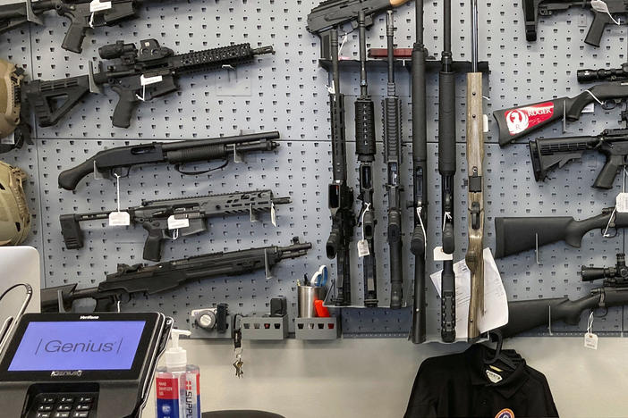 Firearms are displayed at a gun shop in Salem, Ore., on Feb. 19, 2021.