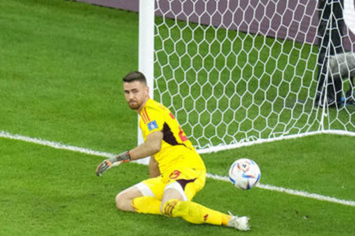 Morocco's Achraf Hakimi scores the decisive penalty Tuesday past Spain's goalkeeper Unai Simon at the end a round of 16 World Cup soccer match at the Education City Stadium in Al Rayyan, Qatar.