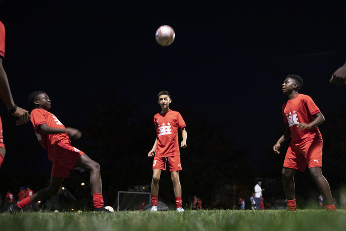 Fifteen-year-olds from a DCXI soccer team practice together in Washington, D.C., in November. Club co-founder and coach Pierre Hedji says some of their team members pay and some don't. "If you can afford to pay the whole thing, pay the whole thing. That way we can afford to help the next kid that can't pay anything at all."