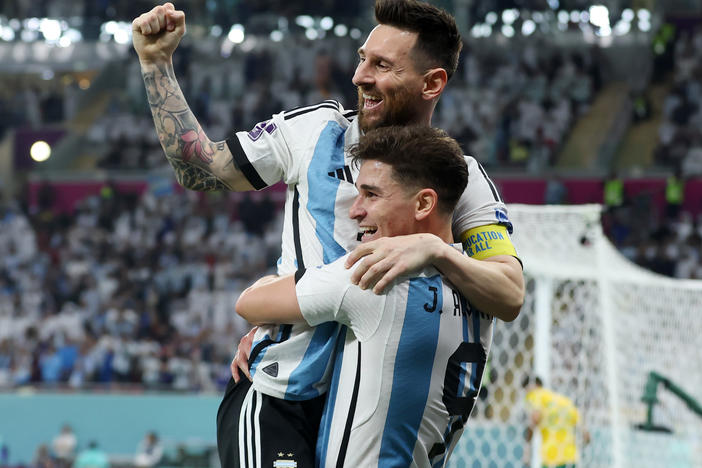 Argentina's Julián Álvarez celebrates while holding Lionel Messi after scoring the team's second goal during the 2022 World Cup's Round of 16 match with Australia at the Ahmad Bin Ali Stadium on Saturday, Dec. 3, in Doha, Qatar.