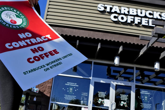 Starbucks employees strike outside their store on Nov. 17 in Mesa, Ariz.