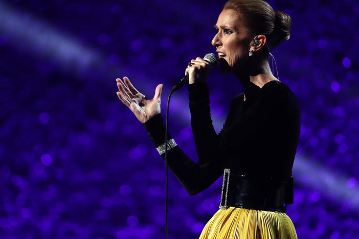 Céline Dion performing in 2019, the year her world tour was original scheduled to begin. It has since been delayed repeatedly, first due to the pandemic and then because of muscle spasms that have now been diagnosed as stiff-person syndrome.