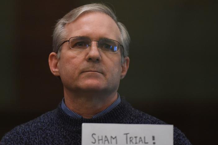 Paul Whelan holds a sign in protest as he awaits his verdict in Moscow in June 2020. He was sentenced to 16 years in prison on charges of espionage.