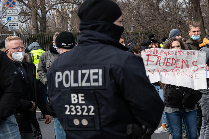 A police officer observes participants in the demonstration of right-wing extremists and Reichsburger on March 20, 2021 in Berlin. German right-wing extremists and "Reich citizens" are growing in number and present a "high level of danger," according to German officials.
