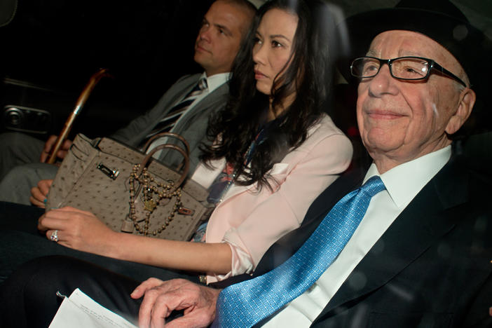 Media magnate Rupert Murdoch, at right, in London a decade ago on his way to give evidence at a British judicial inquiry. He is accompanied by his son (and now Fox Corp boss) Lachlan Murdoch, at left, and his then-wife Wendi Deng.