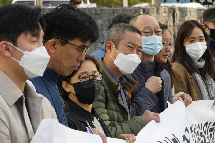 Peter Møller, fourth from left, an attorney and co-founder of the Danish Korean Rights Group, attends a Nov. 15 press conference with a group of South Korean adoptees in front of the Truth and Reconciliation Commission in Seoul, South Korea. Seoul faces growing pressure to reckon with the child export frenzy driven by dictatorships that ruled the country until the 1980s.