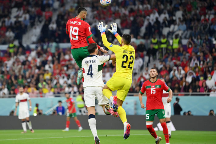 Youssef En-Nesyri of Morocco soars high to head the ball and score the team's first goal during Morocco-Portugal quarterfinal at the World Cup in Qatar on December 10, 2022.