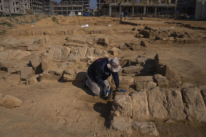 A Palestinian excavation team works in a newly discovered Roman-era cemetery in the Gaza Strip on Sunday. Authorities in Gaza announced the discovery of over 60 tombs in the ancient burial site.
