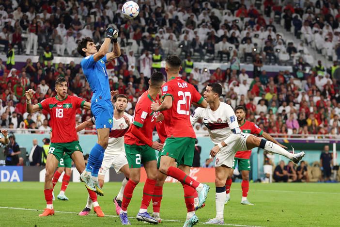 Yassine Bounou of Morocco makes a save during the the World Cup quarterfinal between Morocco and Portugal. Goalkeepers have powered the final four teams left in the tournament.