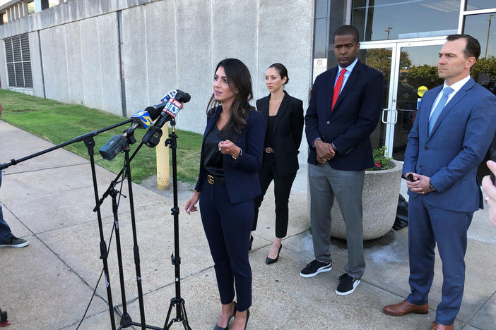 Attorney Alexandra Benevento, center, speaks with reporters during a news conference announcing a cheerleader abuse lawsuit filed in Tennessee on Tuesday, Sept. 27, 2022, in Memphis, Tenn.