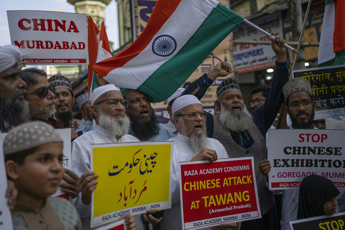 Indians hold placards as they shout slogans during a protest against China in Mumbai, on Tuesday. Soldiers from India and China clashed last week along their disputed border, India's defense minister said.