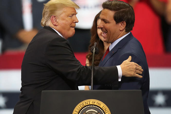 Then-President Donald Trump greets then-Florida Republican gubernatorial candidate Ron DeSantis during a campaign rally at the Hertz Arena on Oct. 31, 2018 in Estero, Fla. In 2024, the two candidates may run against one another for president.