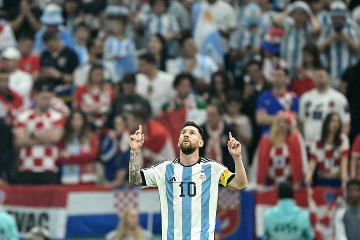 Argentina forward Lionel Messi celebrates scoring his team's first goal from the penalty spot during the World Cup semifinal match between Argentina and Croatia in Qatar on December 13, 2022.