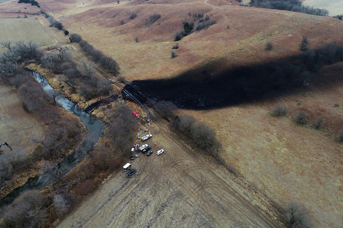 In this photo taken by a drone on Dec. 9, cleanup continues in the area where the ruptured Keystone pipeline dumped oil into a creek in Washington County, Kan.
