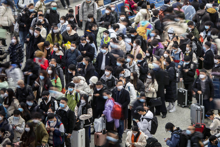 Travelers at Shanghai Hongqiao Railway Station in Shanghai, China on Dec. 12. China's public health officials say up to 800 million people could be infected with the coronavirus over the next few months.