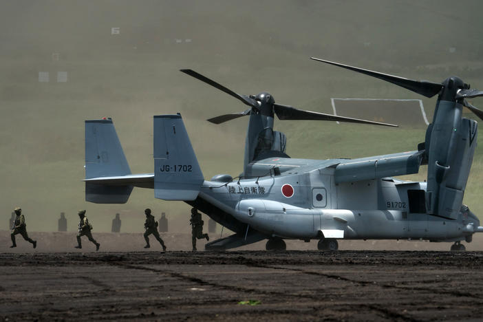 Members of the Japan Ground Self-Defense Force disembark from a V-22 Osprey aircraft during a live-fire exercise at East Fuji Maneuver Area in Gotemba, Shizuoka prefecture, Japan, on May 28. The annual live-fire drill took place as Japanese Prime Minister Fumio Kishida pledged to boost defense spending after a summit with U.S. President Biden and other "Quad" leaders.