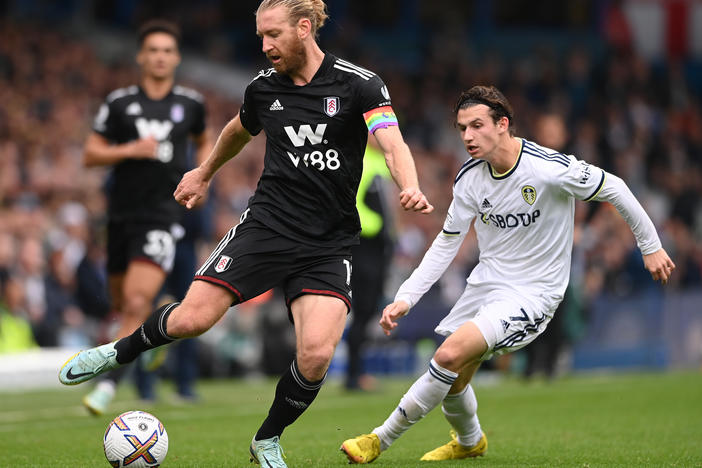 Two U.S. men's national team players — Tim Ream, left, and Brenden Aaronson, right — playing for their respective English Premier League teams in October.