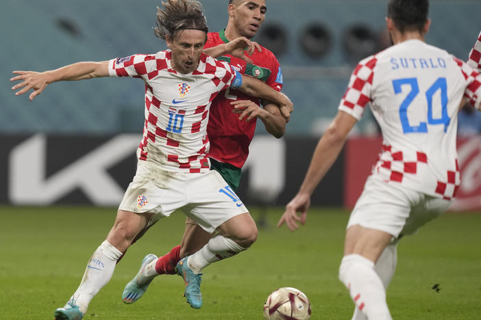 Croatia's Luka Modrić in action in front of Morocco's Achraf Hakimi during the World Cup third-place playoff match between Croatia and Morocco at Khalifa International Stadium in Doha, Qatar on Saturday.