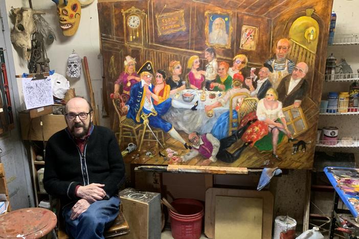 Jonah Kinigstein, 99, has been making art since he was a teenager. Some of his work satirizes modern artists such as Andy Warhol and Jackson Pollock, visible in the painting behind him.