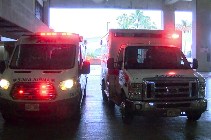 In this image taken from a video provided by Hawaii News Now, ambulances remain outside the international airport in Honolulu after multiple people were seriously injured when a flight to Hawaii hit severe turbulence  Sunday.