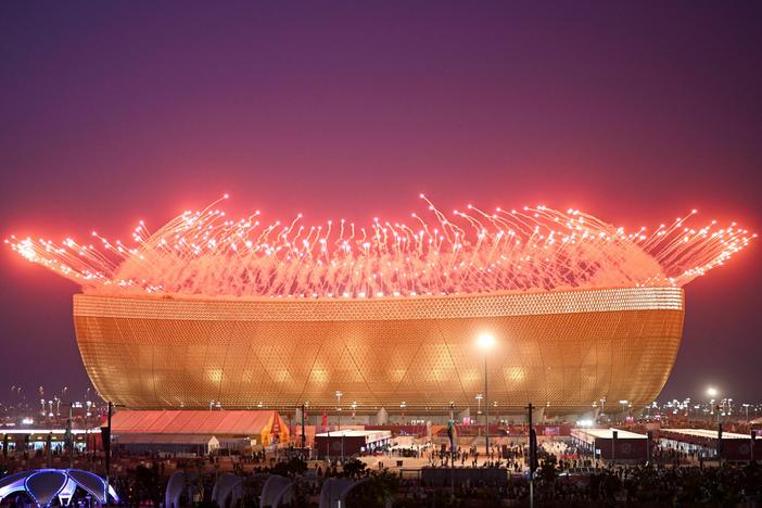 Fireworks are pictured before the start of the Qatar 2022 World Cup final match between Argentina and France at Lusail Stadium north of Doha on December 18, 2022.