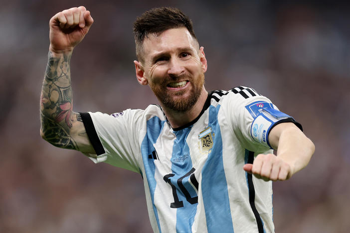 Lionel Messi of Argentina celebrates after scoring the team's third goal during the FIFA World Cup Final match between Argentina and France on December 18, 2022 in Lusail City, Qatar.