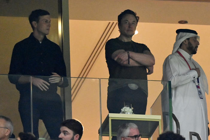 Elon Musk (center), standing with former President Trump's son-in-law Jared Kushner (left) look on during the World Cup Final between Argentina and France in Qatar on December 18.