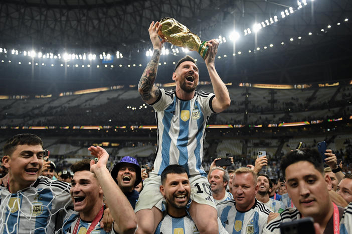 Argentina's Lionel Messi sits on Sergio 'Kun' Aguero's shoulders as their team celebrates their victory over France in the 2022 World Cup final on Sunday, Dec. 18, at the Lusail Stadium in Lusail City, Qatar.