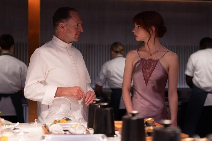 Ralph Fiennes and Anya Taylor-Joy in the film <em>The Menu</em>.