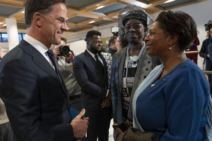 Dutch Prime Minister Mark Rutte talks to invited guests after apologizing on behalf of his government for the Netherlands' historical role in slavery and the slave trade at the National Archives in The Hague, Monday, Dec. 19, 2022.