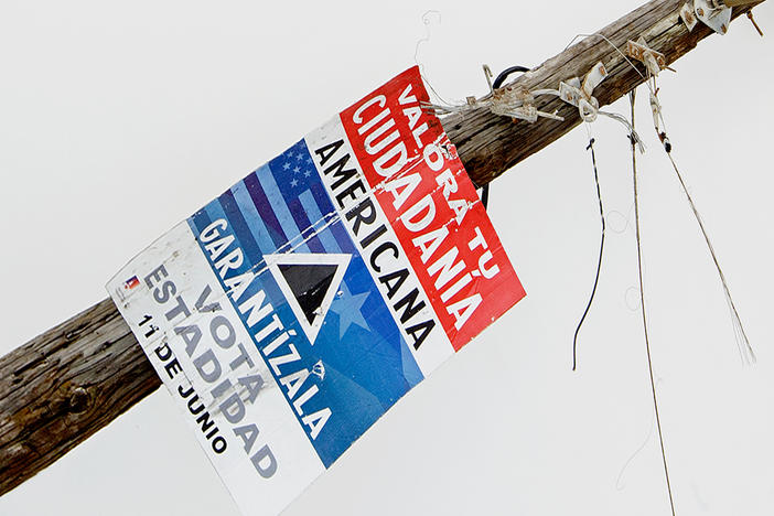 Gabriella Torres-Ferrer, <em>Untitled (Valora tu mentira americana)</em> (detail), 2018. Hurricane-ravaged wooden electric post with statehood propaganda. Private collection; courtesy of the artist and Embajada, San Juan.