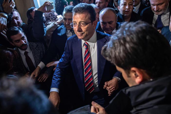 Mayor Ekrem Imamoglu leaves a rally in front of the Istanbul Metropolitan Municipality building in Istanbul on Dec. 14, following a Turkish court decision to sentence him to two years and seven months in prison for insulting election officials.