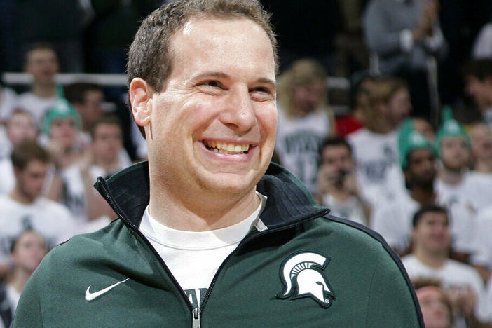 Former Michigan State player Mat Ishbia laughs as he's introduced along with Michigan State's 2000 national championship NCAA college basketball team during halftime of the Michigan State-Florida game in East Lansing, Mich. The mortgage executive has agreed in principle to buy the Phoenix Suns and Phoenix Mercury from the embattled owner Robert Sarver for $4 billion.