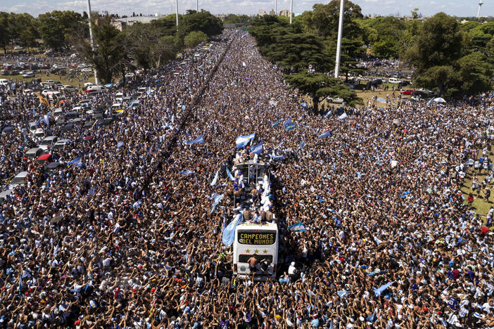 The Argentine soccer team that won the World Cup title ride on an open bus during their homecoming parade in Buenos Aires, Argentina, Tuesday, Dec. 20, 2022.