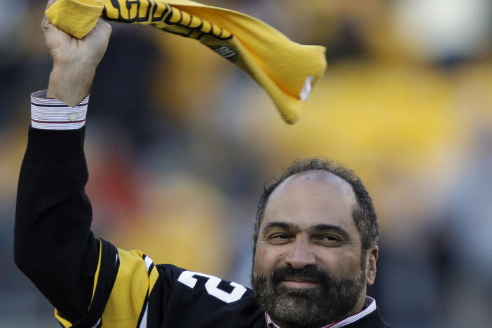 Pittsburgh Steelers Hall of Fame running back Franco Harris twirls a Terrible Towel during a ceremony on Dec. 23, 2012, commemorating the 40th anniversary of his "Immaculate Reception" catch in the 1972 playoff game against the Oakland Raiders, in Pittsburgh. Harris died Wednesday. He was 72.