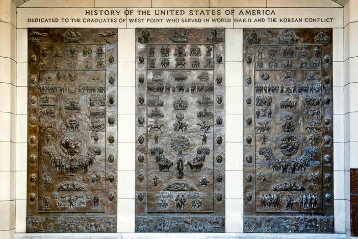 Three bronze panels at one of the entrances to Bartlett Hall, at West Point depict the history of the United States. In coming days, the U.S. military academy will begin taking down memorials commemorating figures of the Confederacy.