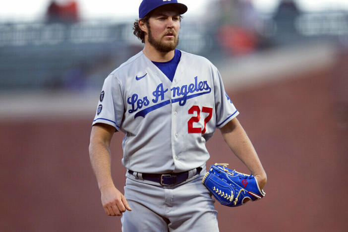Los Angeles Dodgers starting pitcher Trevor Bauer pauses in May 2021 while working against the San Francisco Giants in San Francisco.