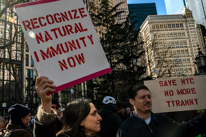 People gather at City Hall to protest New York City's vaccine mandate for public employees on Feb. 11, the day that many were fired.