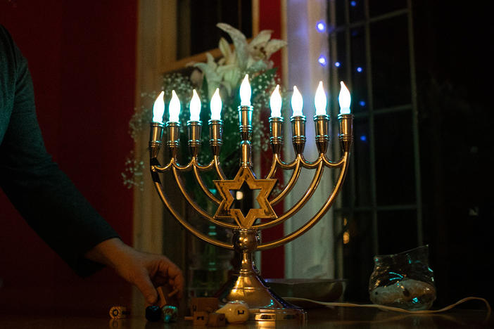Beth Richman lights up her menorah in her home in Portland, Ore. Like many in the American Jewish community, Richman is concerned about the rising currents of antisemitism. She says putting her electric menorah in her window feels like an important act of resistance.