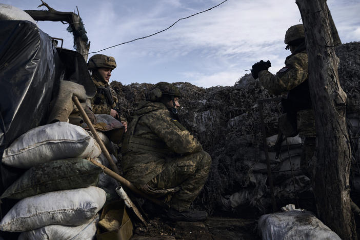 Ukrainian soldiers take position during fights with Russian forces near Maryinka, Donetsk region, Ukraine, on Friday.