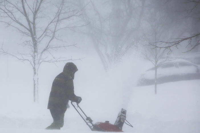 A winter storm rolls through Amherst, N.Y., on Saturday. Power has been knocked out power to hundreds of thousands of homes and businesses across the country.