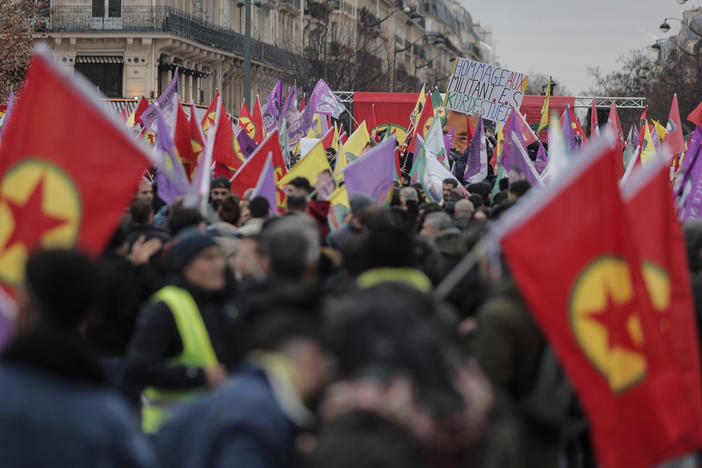 Kurdish activist and anti-racism group stage a protest against the recent shooting at the Kurdish culture center, holding Kurdistan Workers Party, PKK, flag in Paris, Saturday, Dec. 24, 2022. Kurdish activists, left-wing politicians and anti-racism groups are holding a protest Saturday in Paris after three people were killed at a Kurdish cultural center in an attack aimed at foreigners.