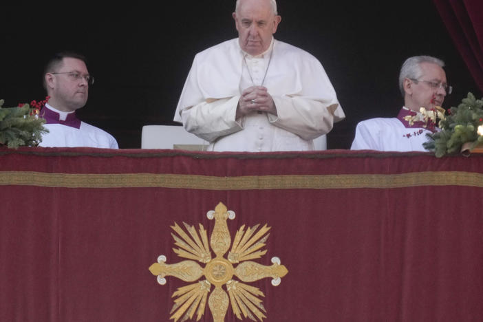 Pope Francis delivers the Urbi et Orbi (Latin for 'to the city and to the world') Christmas day blessing from the main balcony of St. Peter's Basilica at the Vatican on Sunday.